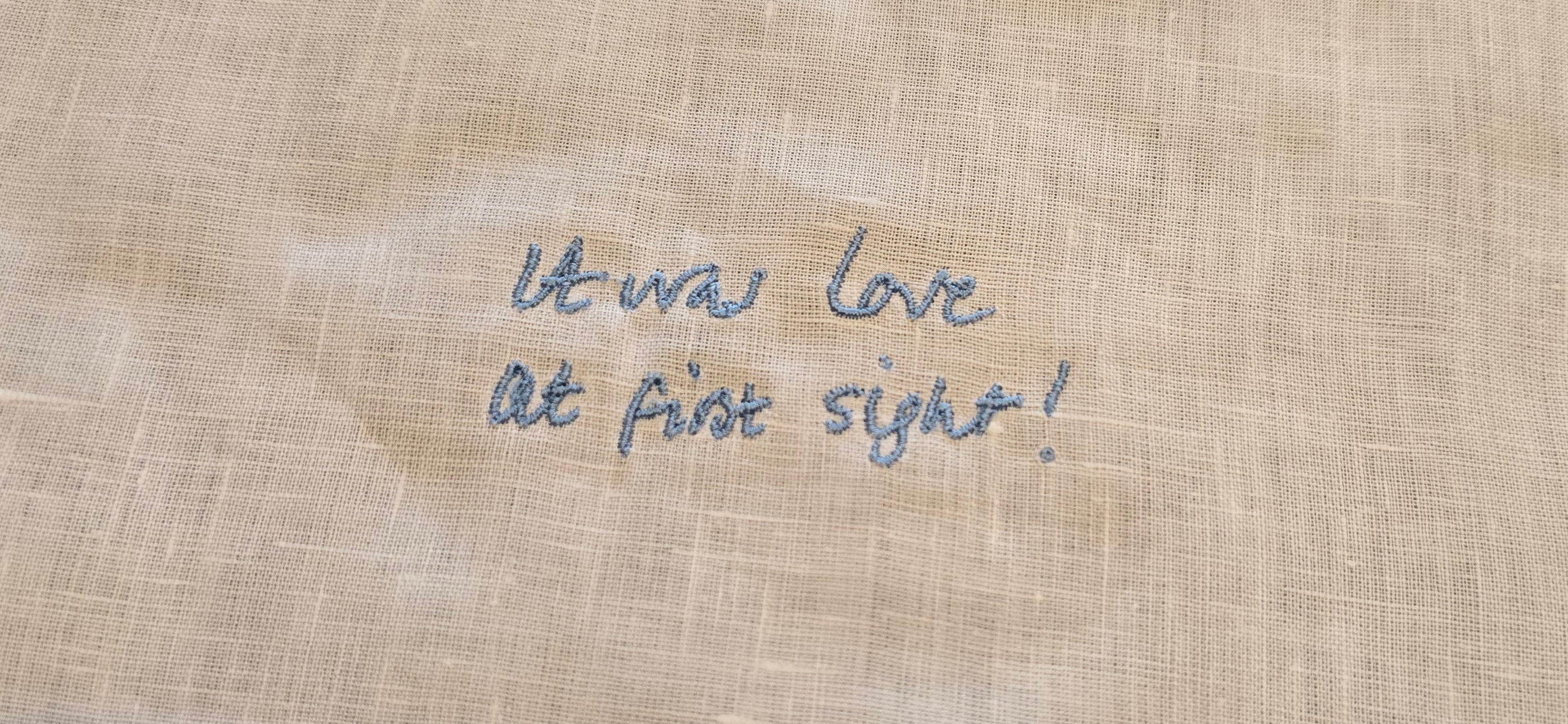 'It was love at first sight!' embroidered on fabric